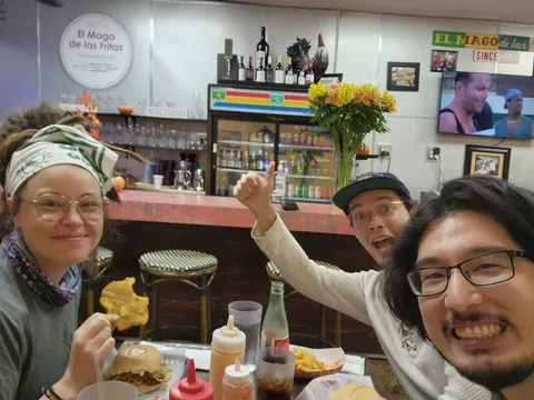 Lab members giving a thumbs-up over lunch at El Mago de las Fritas in Miami