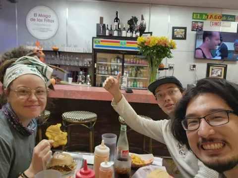 Lab members celebrating over Cuban food at El Mago de las Fritas in Miami