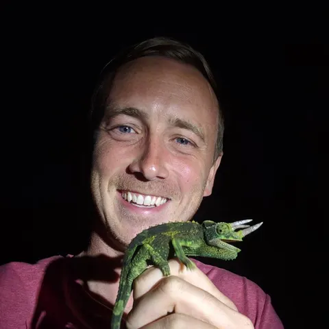 James Stroud holding a Jackson's chameleon