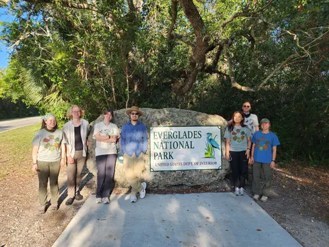 The summer 2025 field team at the Everglades National Park entrance sign